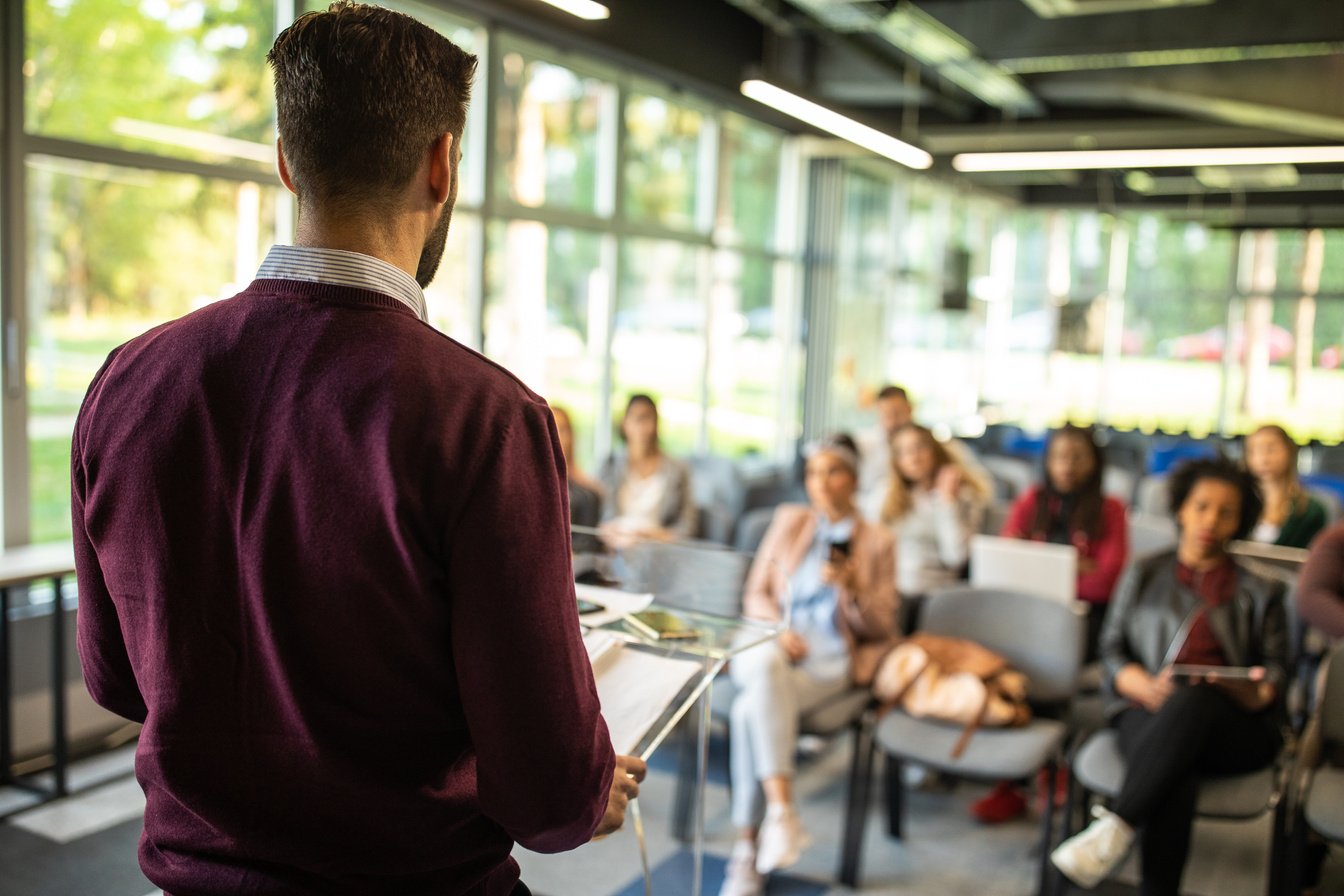 Man Speaking in front of Audience